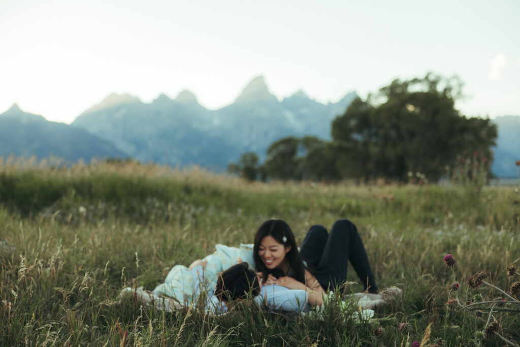 Engagement photos in the Tetons, shot of a couple having a picnic in the Tetons.
