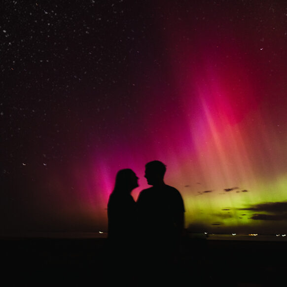 Couples Photos Under the Northern Lights. Aurora Engagement Photos.
