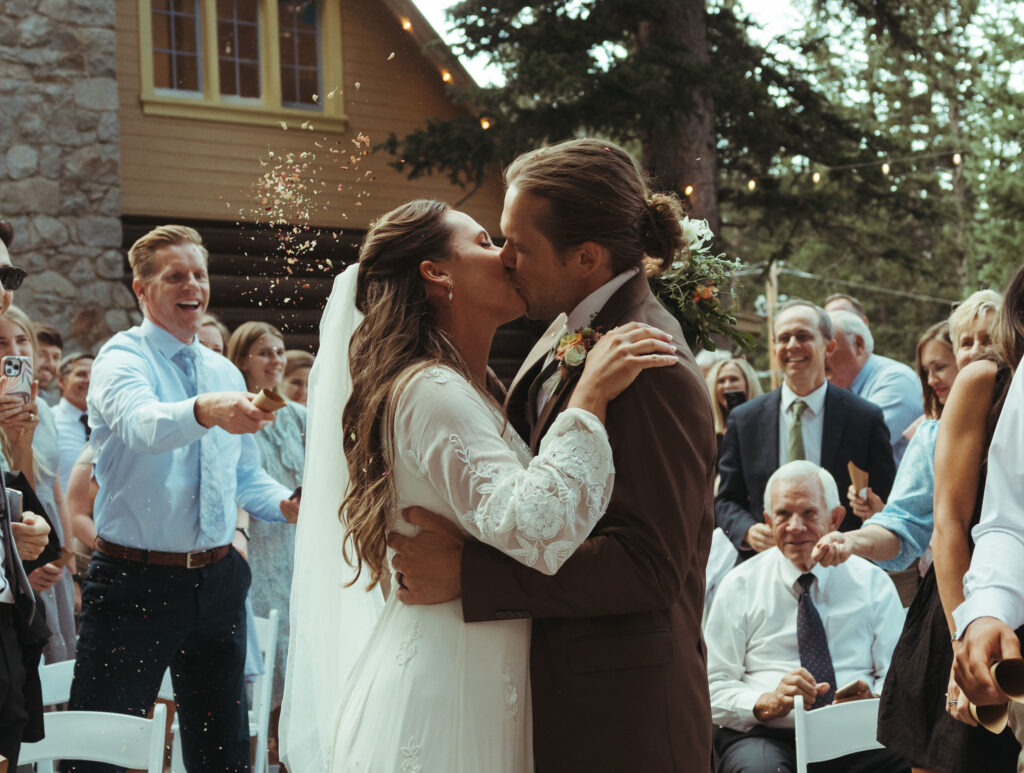 bride and groom kissing at utah wedding venue